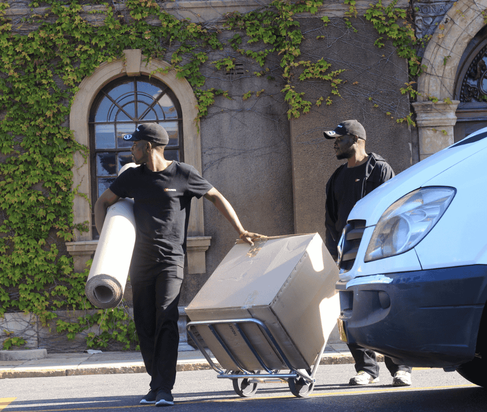 Professional Packers for Furniture Removals carefully wrapping household items – Conneck Transport